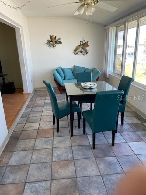 dining space with lofted ceiling and ceiling fan