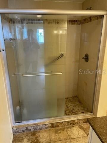 bathroom with vanity and an enclosed shower