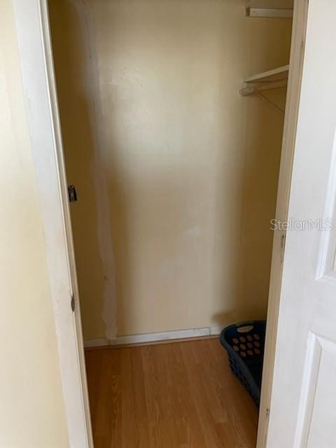 spacious closet featuring hardwood / wood-style flooring