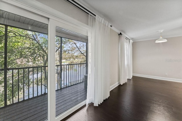 entryway featuring crown molding and dark hardwood / wood-style floors