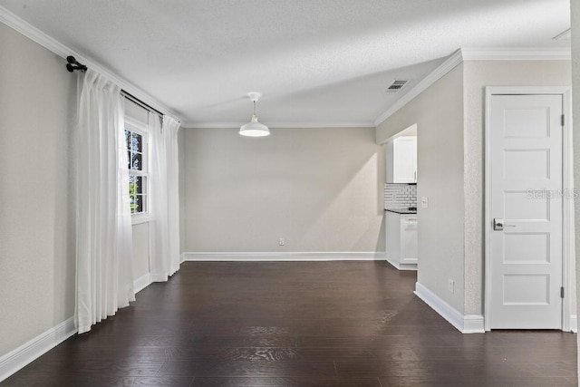 unfurnished room with dark hardwood / wood-style flooring and ornamental molding