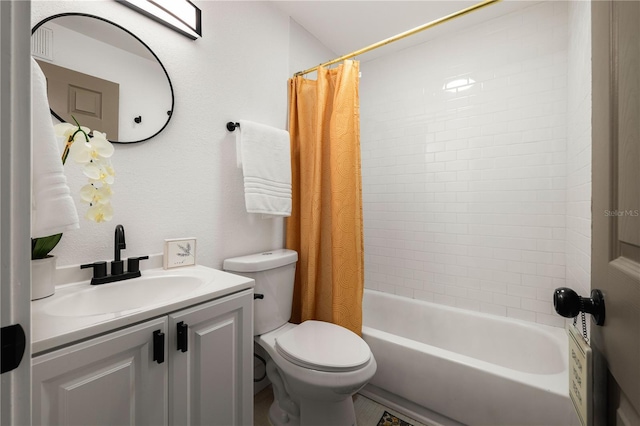 full bathroom featuring vanity, shower / bath combo, and toilet