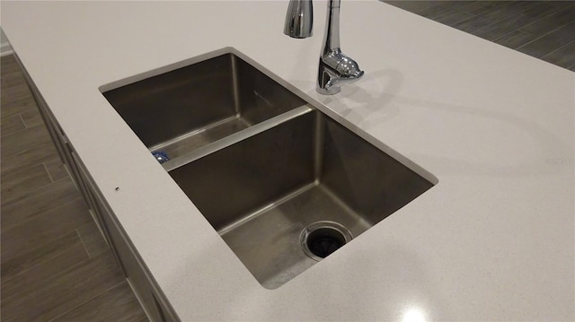 room details featuring dark wood-type flooring and sink