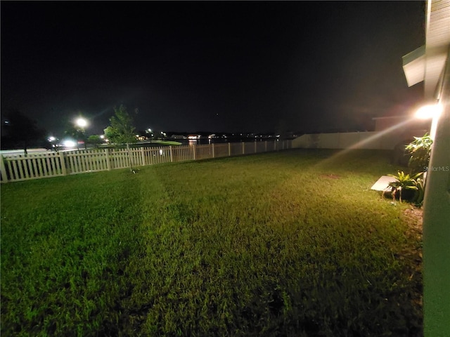 view of yard at twilight