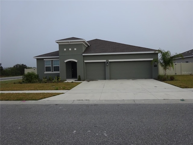 view of front of property featuring a garage