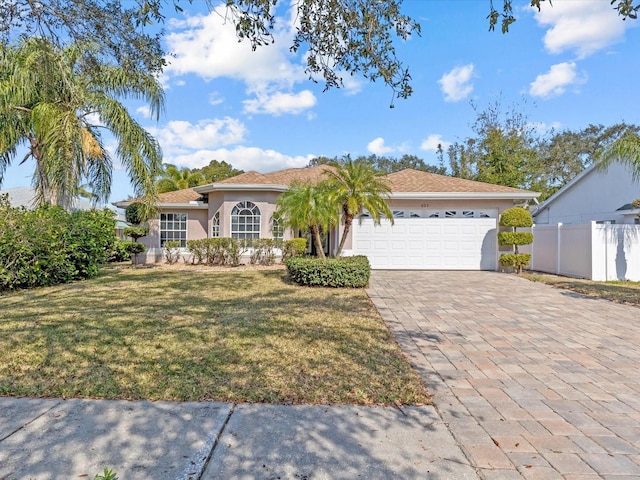 view of front facade with a garage and a front yard