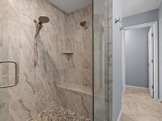 bathroom featuring a shower with shower door