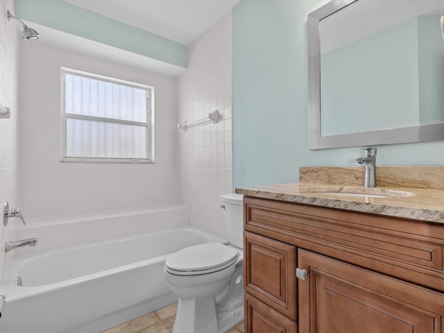 full bathroom featuring vanity, tiled shower / bath combo, and toilet