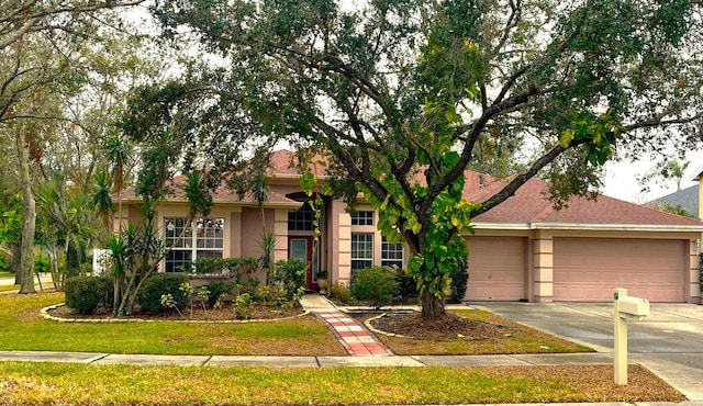 ranch-style house featuring a garage