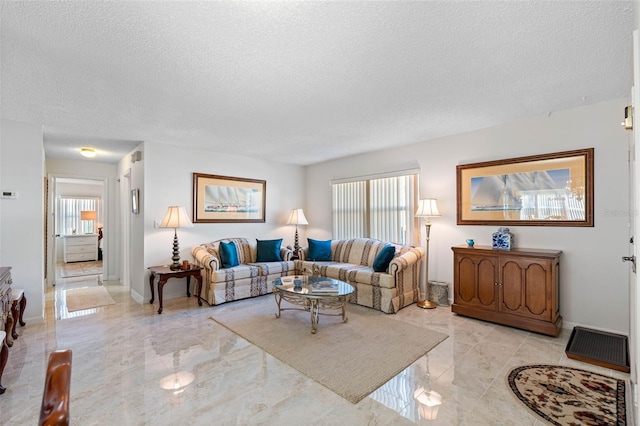 living room featuring a textured ceiling