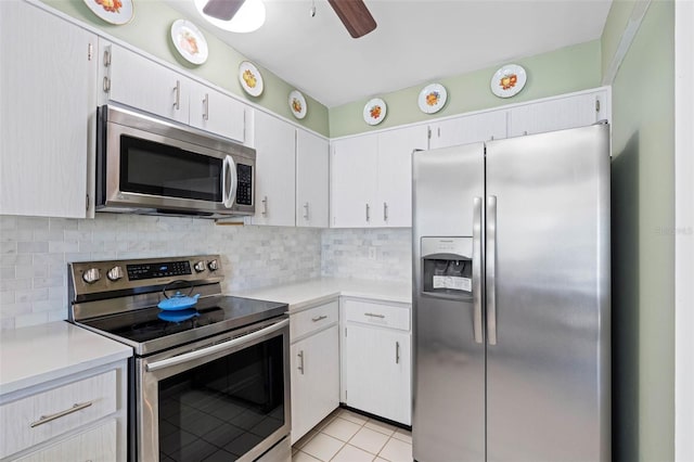 kitchen with backsplash, stainless steel appliances, white cabinets, and ceiling fan