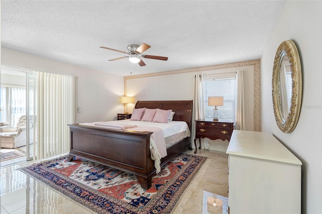 bedroom with access to exterior, a textured ceiling, and ceiling fan