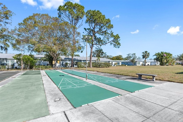 view of property's community with a lawn