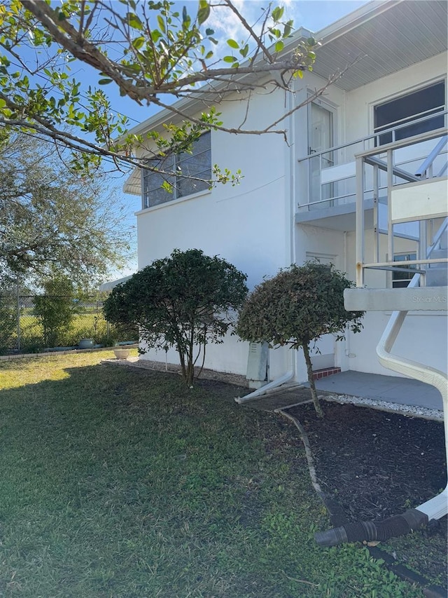 view of home's exterior featuring a lawn