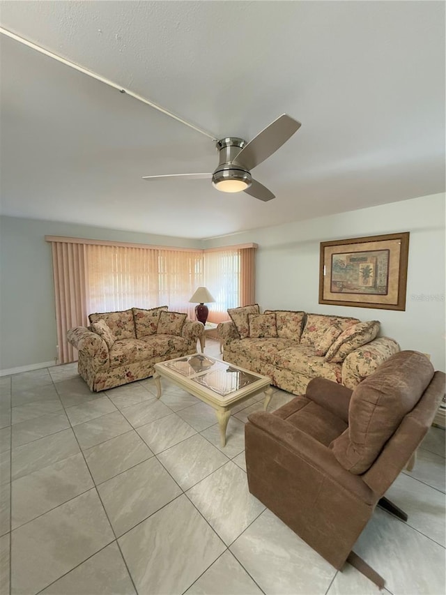 tiled living room featuring ceiling fan