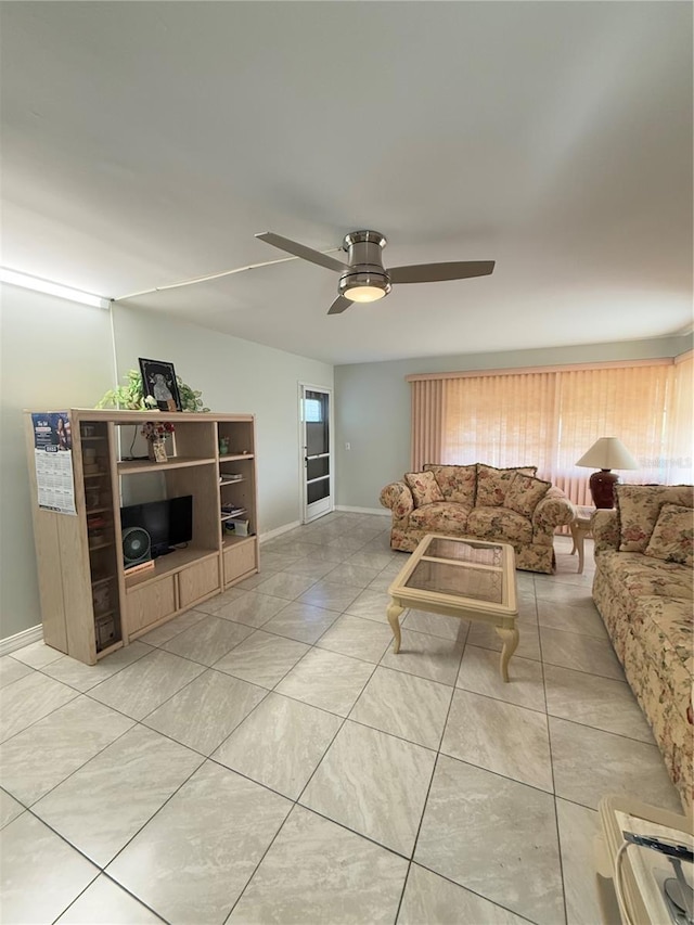 tiled living room with ceiling fan