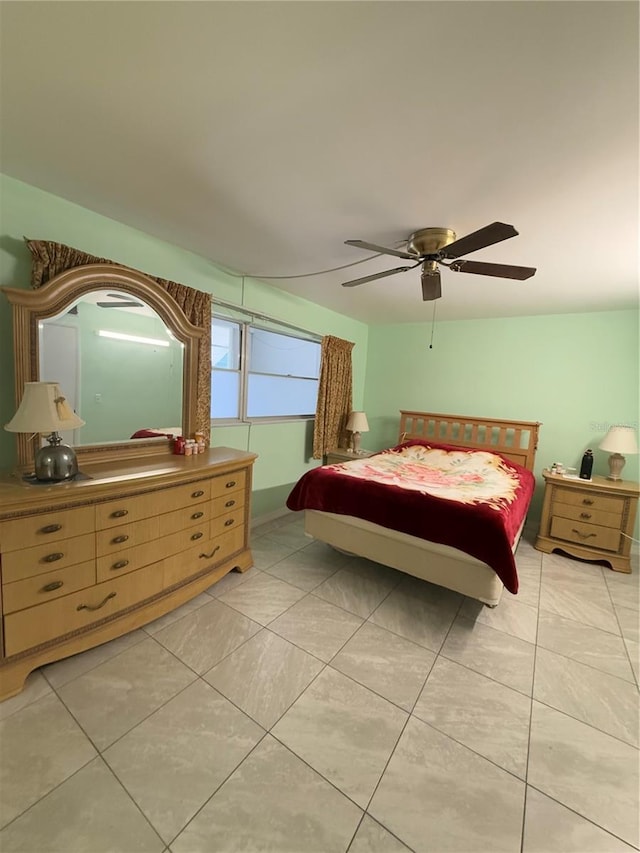 tiled bedroom with ceiling fan