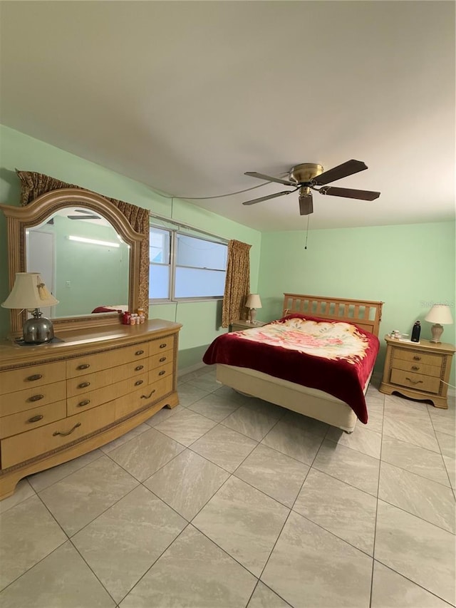 bedroom featuring ceiling fan and light tile patterned flooring