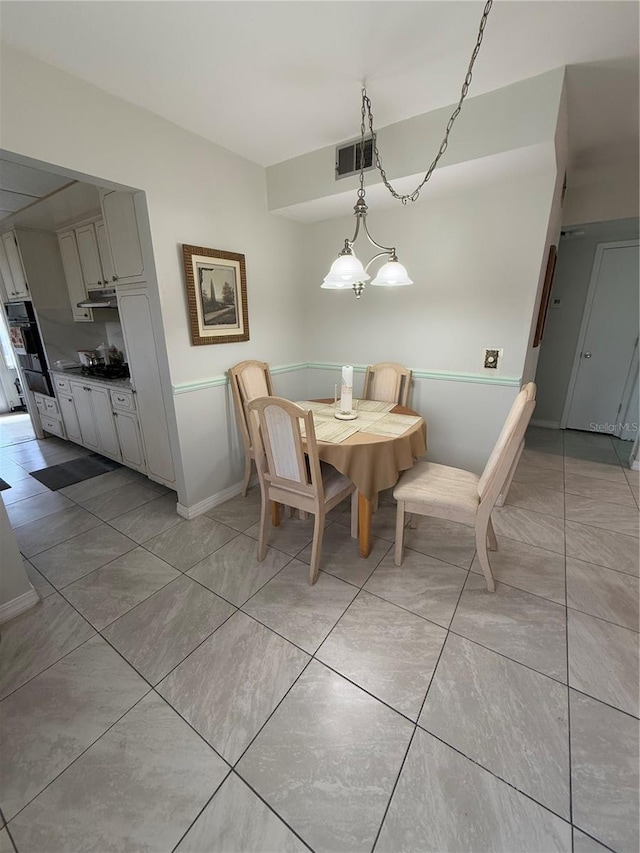 dining space with light tile patterned flooring