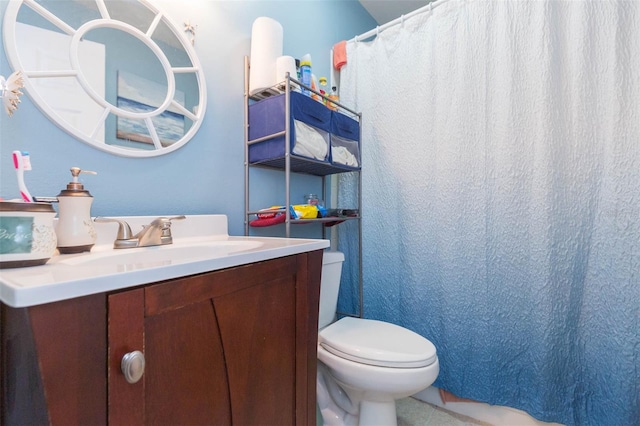 bathroom with vanity and toilet