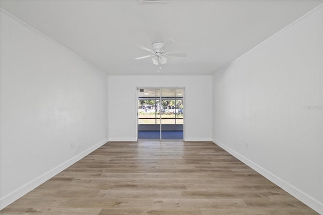 unfurnished room with ceiling fan and light wood-type flooring