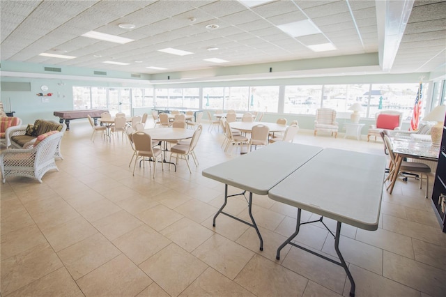 recreation room with a drop ceiling