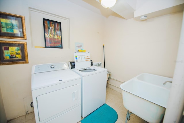 laundry area featuring sink and washer and dryer