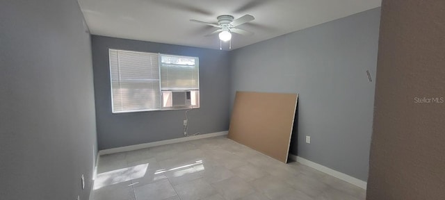 spare room featuring cooling unit and ceiling fan