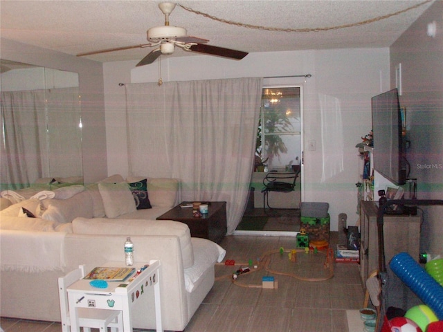 living room featuring tile patterned floors and ceiling fan