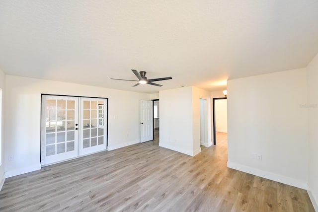 spare room with french doors, ceiling fan, light hardwood / wood-style flooring, and a textured ceiling