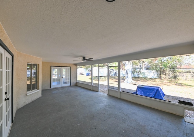 unfurnished sunroom featuring french doors