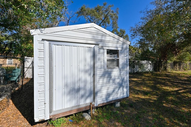 view of outbuilding featuring a yard