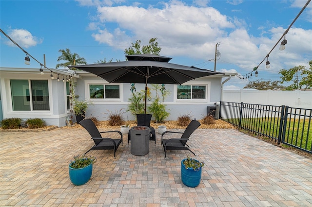 view of patio featuring a fire pit