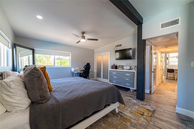 bedroom featuring beam ceiling and ceiling fan