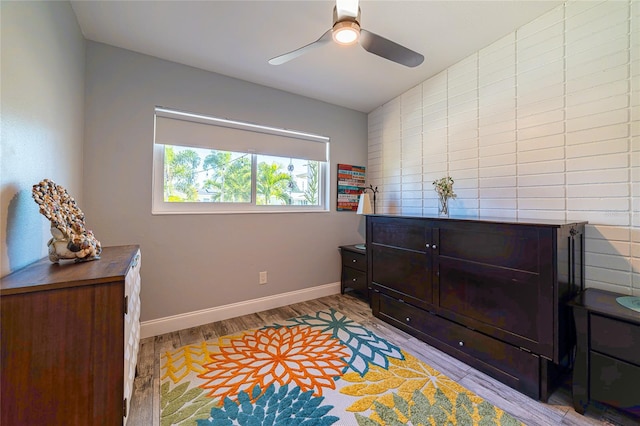 bedroom with ceiling fan and light hardwood / wood-style floors