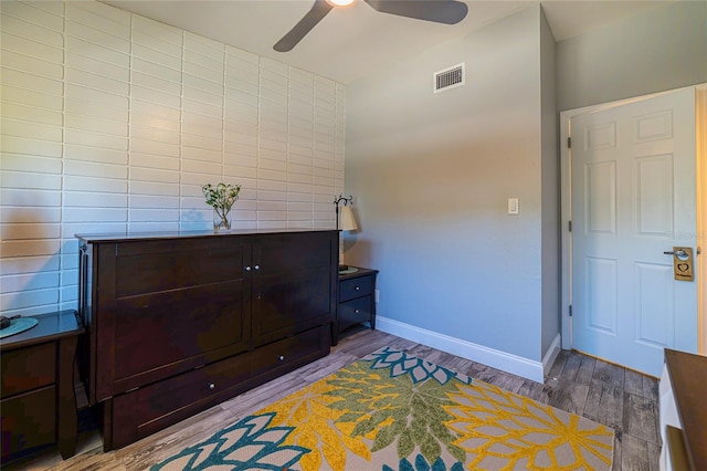 bedroom with hardwood / wood-style floors and ceiling fan