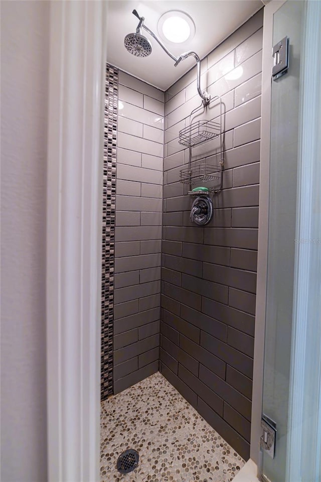 bathroom with tiled shower