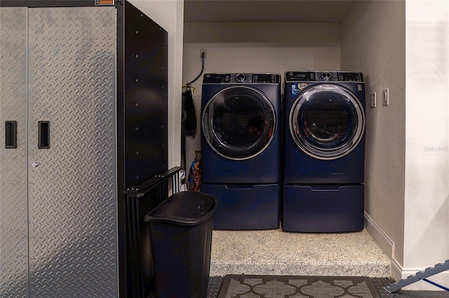 washroom with independent washer and dryer