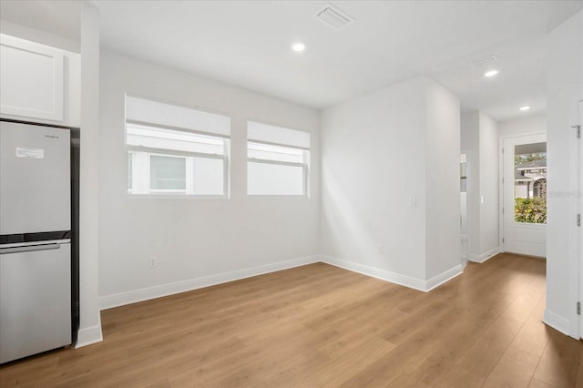 empty room with light wood-type flooring