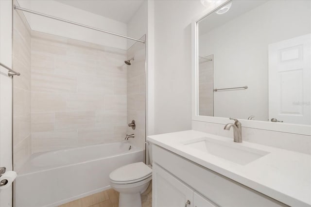 full bathroom with tiled shower / bath combo, vanity, and toilet