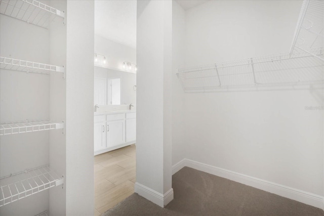 walk in closet featuring light wood-type flooring