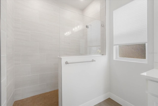 bathroom with a tile shower