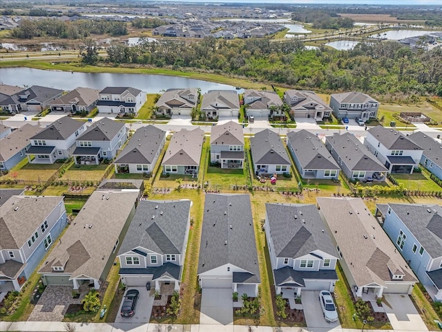 birds eye view of property featuring a water view