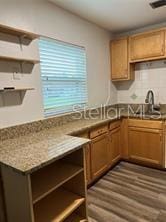 kitchen featuring dark hardwood / wood-style floors, sink, and backsplash