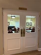 doorway with hardwood / wood-style flooring