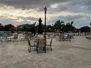 view of patio terrace at dusk