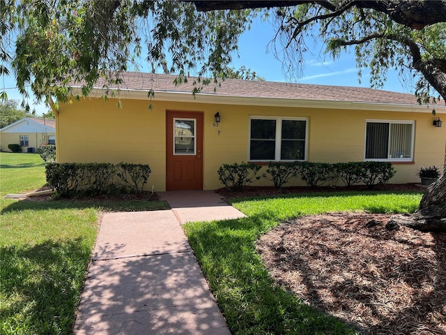 401 Dorchester Pl Unit 62, Sun City Center, FL 33573 - single story home featuring a front yard, concrete block siding, and a shingled roof