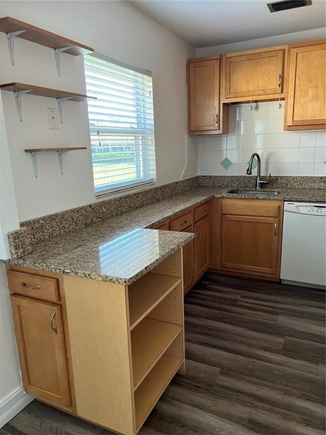 401 Dorchester Pl Unit 62, Sun City Center, FL 33573 - kitchen featuring dishwasher, a sink, open shelves, dark wood-style floors, and tasteful backsplash
