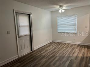 401 Dorchester Pl Unit 62, Sun City Center, FL 33573 - spare room with ceiling fan, baseboards, and wood finished floors
