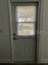 401 Dorchester Pl Unit 62, Sun City Center, FL 33573 - entryway with healthy amount of natural light and baseboards